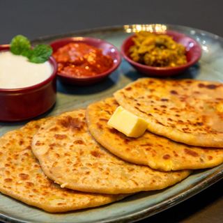 A warm Indian meal served on a plate